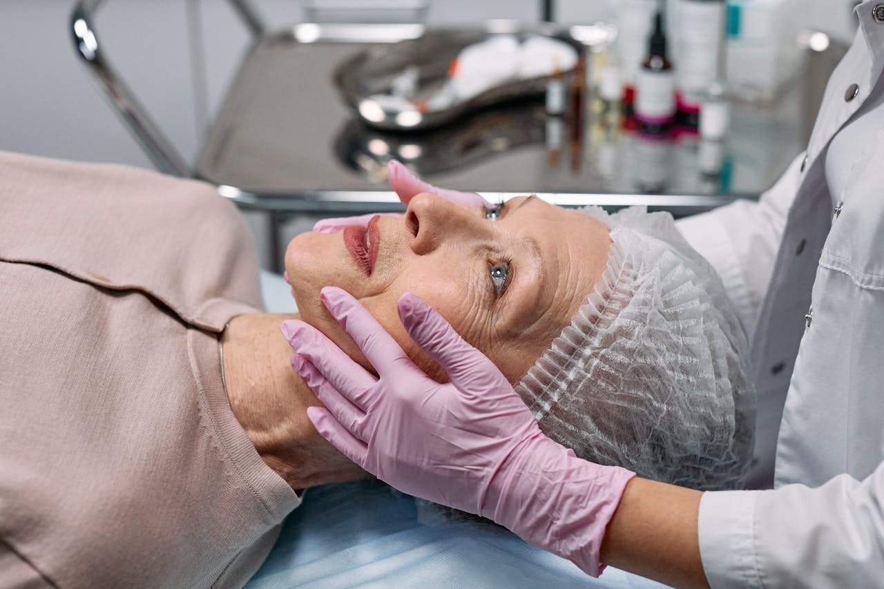 Home Medical professional examining a senior woman